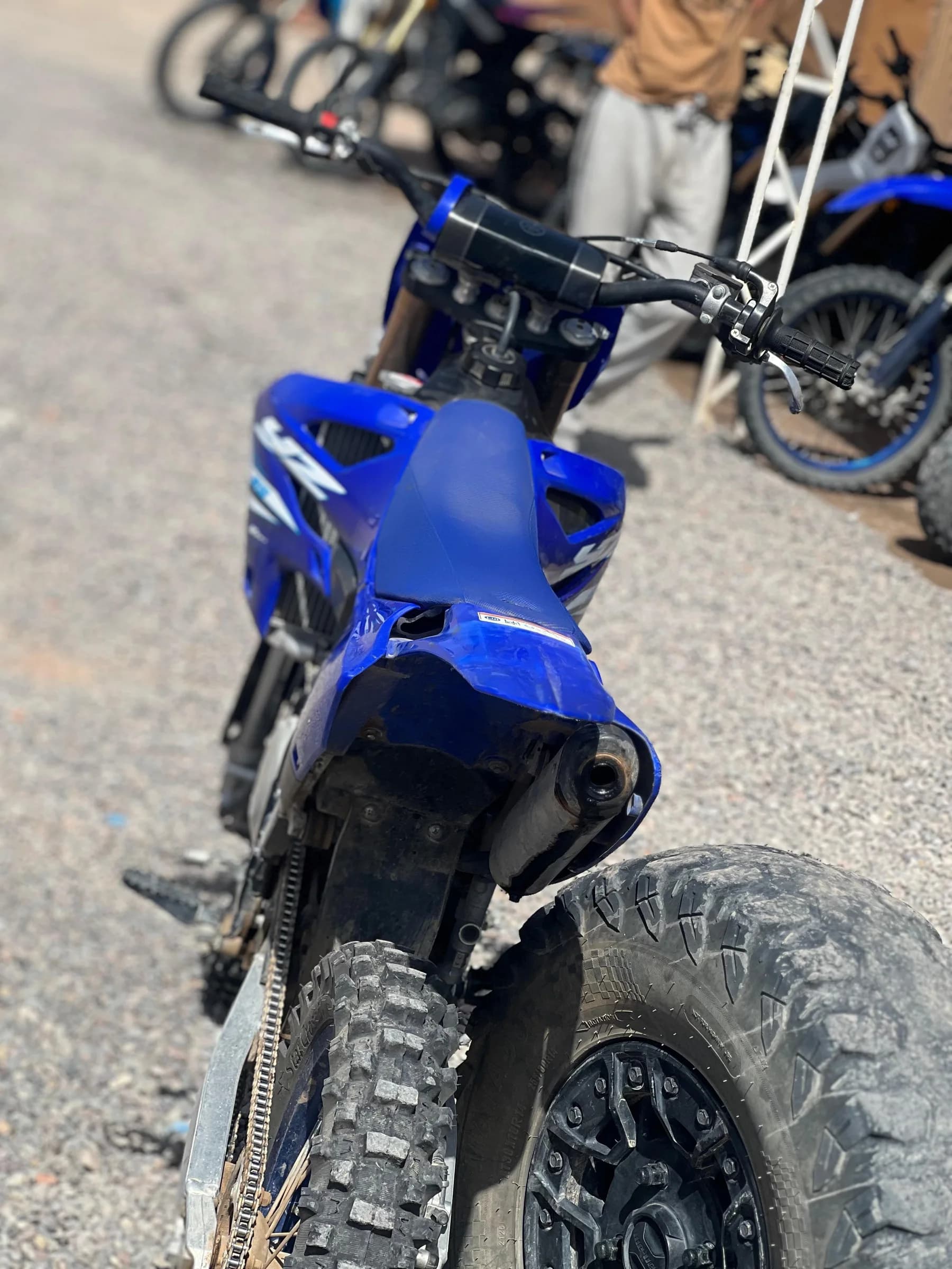 Close-up of a dirt bike rear wheel and chain