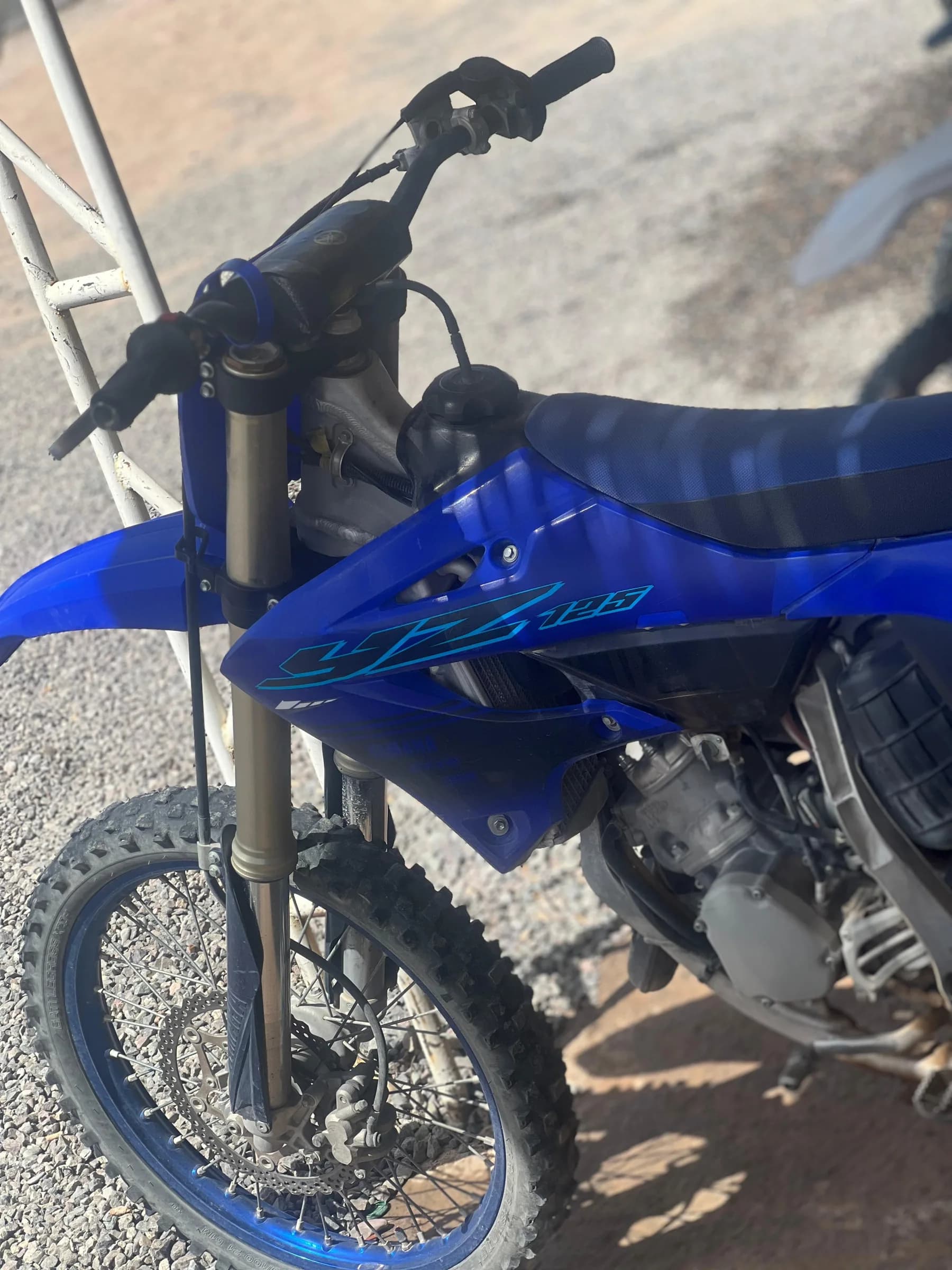 Close-up of a dirt bike front fork and wheel