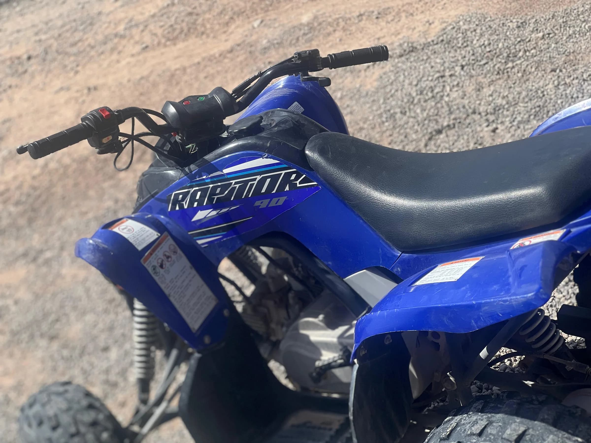 Close-up of a quad bike handlebar and dashboard